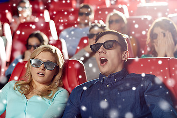 Image showing scared friends watching horror movie in 3d theater