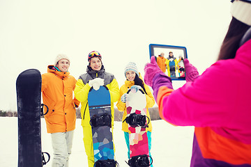 Image showing happy friends with snowboards and tablet pc