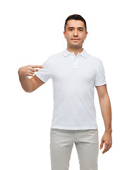 Image showing smiling man in t-shirt pointing finger on himself