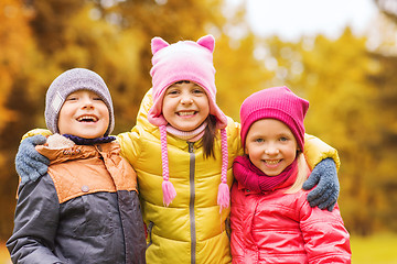 Image showing group of happy children hugging in autumn park