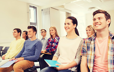 Image showing group of smiling students in lecture hall