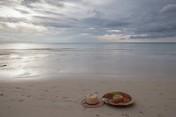 Image showing Beach on tropical island. Clear blue water, sand, clouds. 