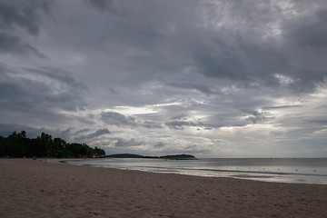 Image showing Beach on tropical island. Clear blue water, sand, clouds. 