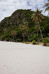 Image showing Beach on tropical island. Clear sand, clouds. 