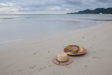 Image showing Beach on tropical island. Clear blue water, sand, clouds. 