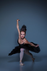 Image showing Portrait of the ballerina in ballet tatu on blue background