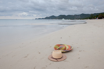 Image showing Beach on tropical island. Clear blue water, sand, clouds. 