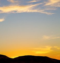 Image showing the sunrise in  colored sky white soft clouds and abstract backg