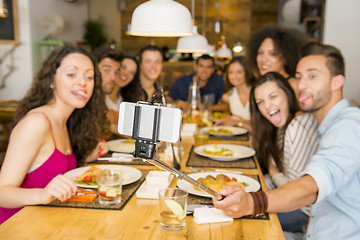 Image showing Friends at the restaurant making a selfie