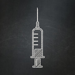 Image showing Healthcare concept: Syringe on chalkboard background
