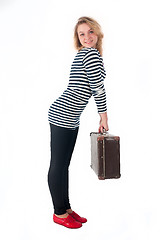 Image showing Pretty young woman with suitcase