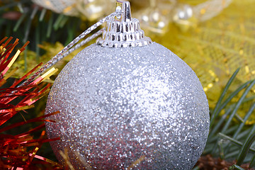 Image showing Closeup of Christmas balls and green fir tree branch, new year invitation card