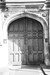 Image showing parliament in london old church door and marble antique  wall