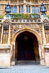 Image showing parliament in london old church door and marble antique  wall