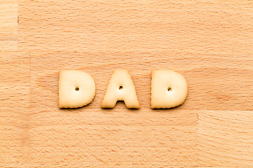 Image showing Word Dad biscuit over the wooden background