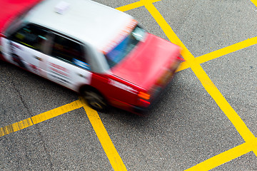 Image showing Motion blurred Taxis in Hong Kong.