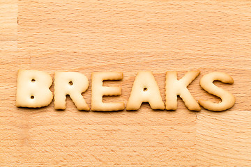 Image showing Word break biscuit over the wooden background