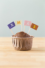 Image showing Chocolate muffins with small flag of a x mas