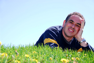 Image showing Smiling man on grass