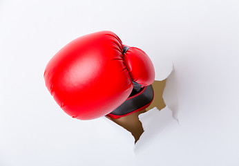 Image showing Hand break through paper with boxing gloves