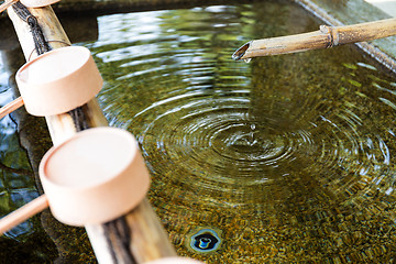 Image showing Water purification at entrance of the Japanese temple