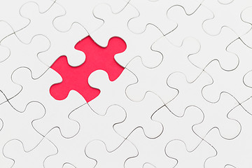 Image showing Puzzle with missing piece over red background