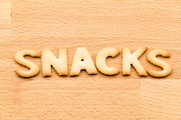 Image showing Word snacks cookie over the wooden background