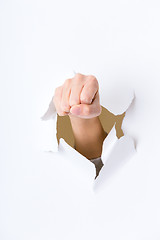 Image showing Fist punching paper