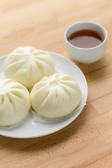 Image showing Chinese steamed buns on wood background