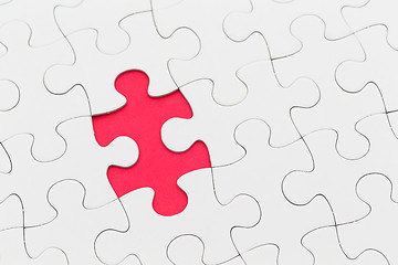 Image showing Jigsaw puzzle with missing piece over red background