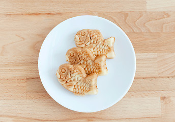 Image showing Taiyaki of japanese traditional baked sweets on wooden table