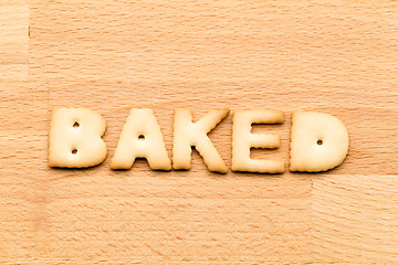 Image showing Word baked biscuit over the wooden background