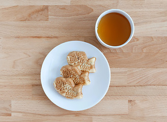 Image showing Taiyaki, japanese fish shape cake with tea