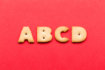 Image showing ABCD cookie over the red background