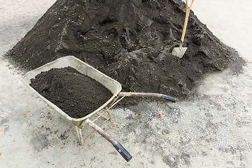 Image showing Shovel for construction works on a heap of old asphalt