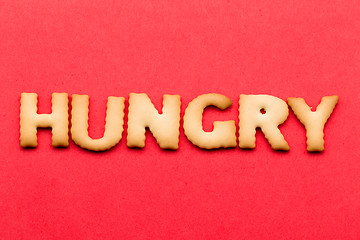 Image showing Word hungry cookie over the red background