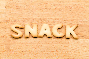 Image showing Word snack biscuit over the wooden background