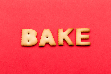Image showing Word bake cookie over the red background