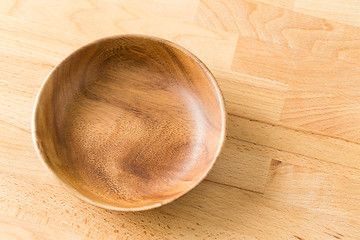 Image showing Vintage empty wooden plate on oak table wood
