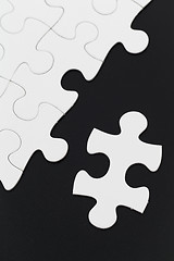 Image showing White puzzle on black background