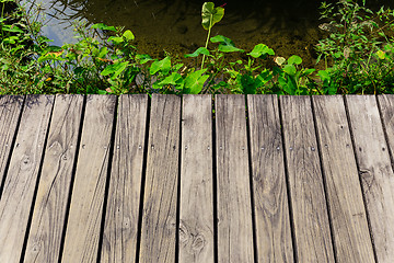 Image showing Wooden floor over the river