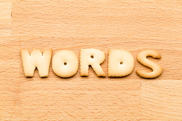 Image showing Letter words biscuit over the wooden background