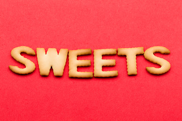 Image showing Word sweets cookie over the red background