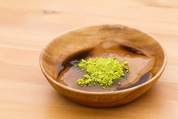 Image showing Japanese dessert with green tea and black sugar