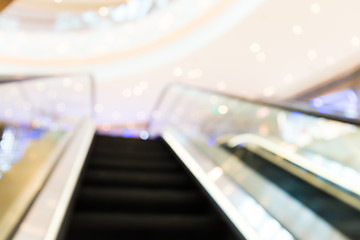 Image showing Escalator blur background with bokeh light.