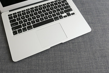 Image showing Laptop on blue cloth background