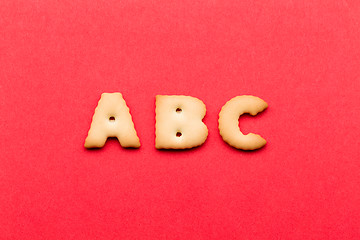 Image showing ABC cookie over the red background