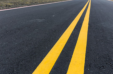 Image showing Asphalt road with pair of yellow line