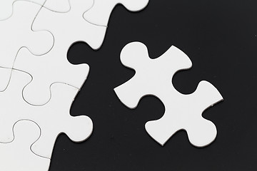 Image showing Jigsaw puzzle on black background