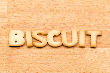 Image showing Word biscuit over the wooden background